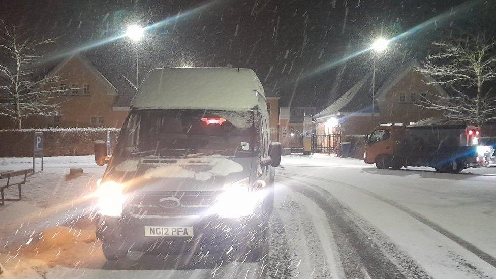 Bus travelling in the snow