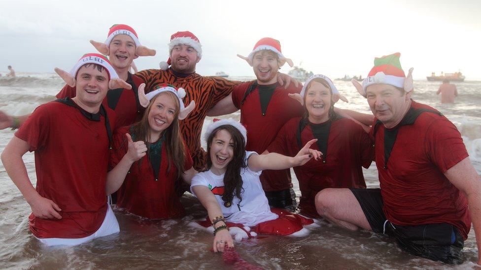 Swimmers dressed as elves at Exmouth