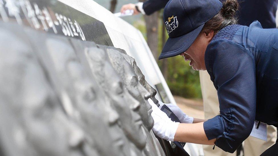 Families of the victims pay tribute last year in the 15th anniversary of the battle