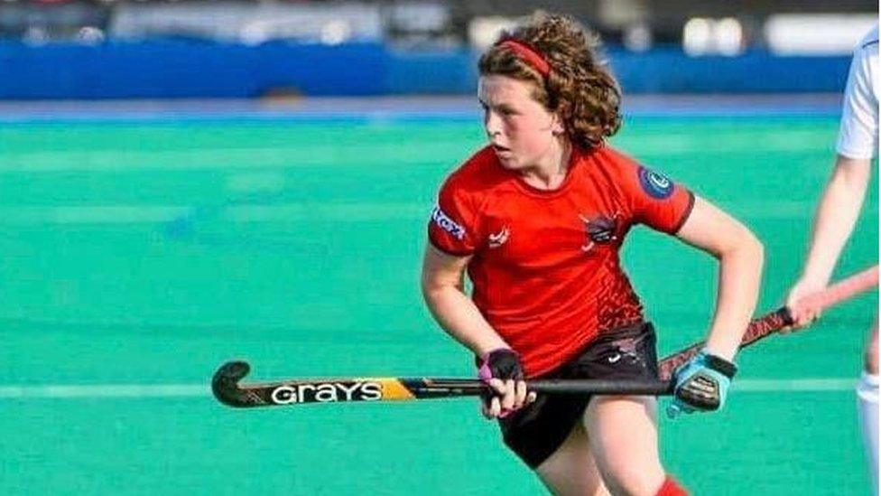 Girl playing hockey