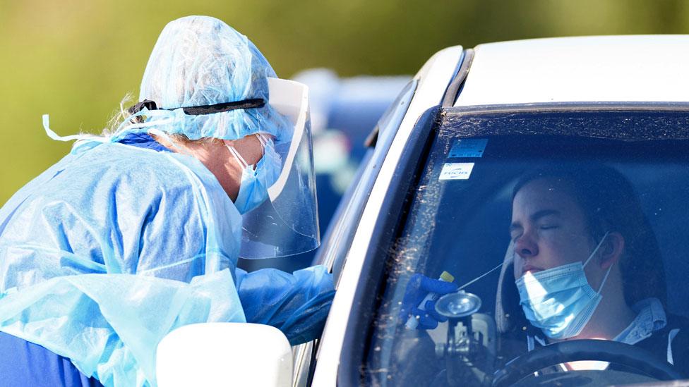 A person is tested at the Pages Road drive through Covid-19 Testing Centre on 21 August 2021 in Christchurch, New Zealand