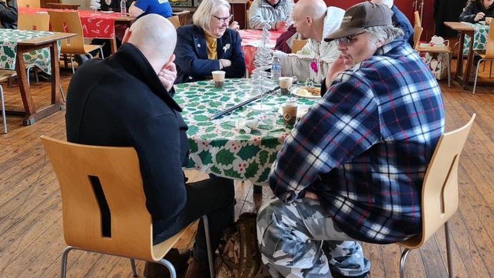 A group of people, including the Lord Mayor of Newcastle, around a table