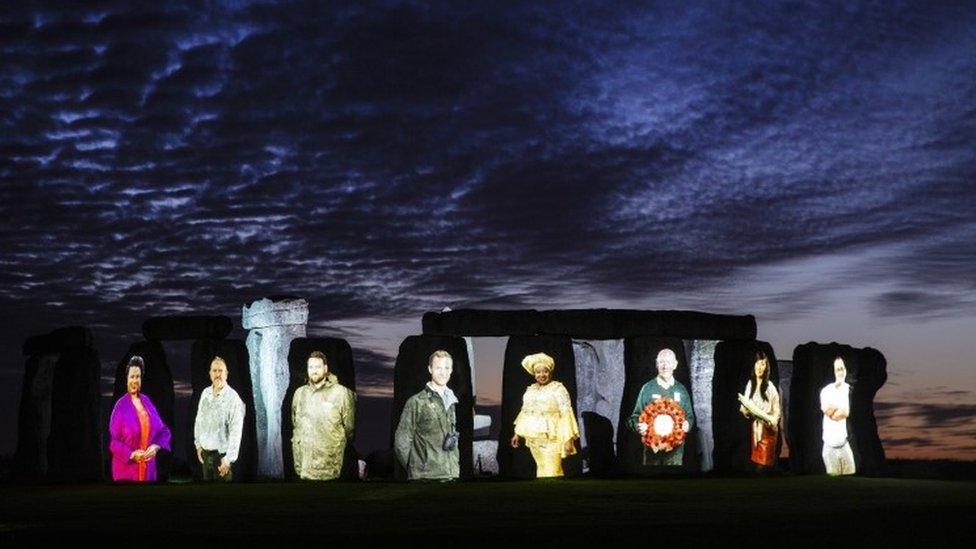 Stonehenge with faces on it.