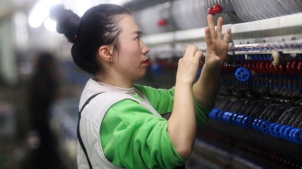 A worker at a silk company in Chongqing, China