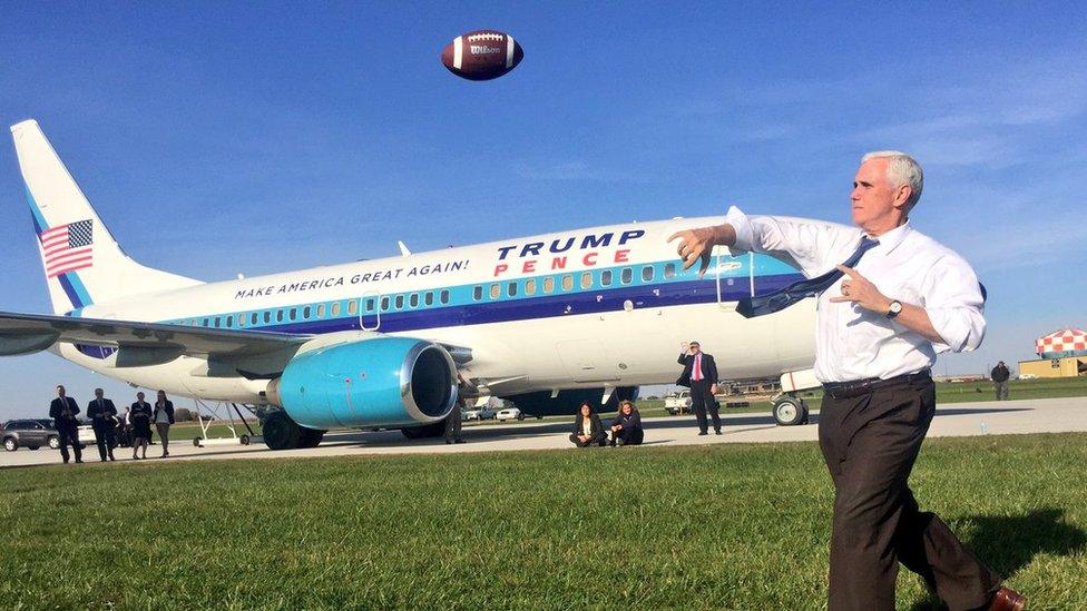 Mike Pence playing football while waiting for grounded plane