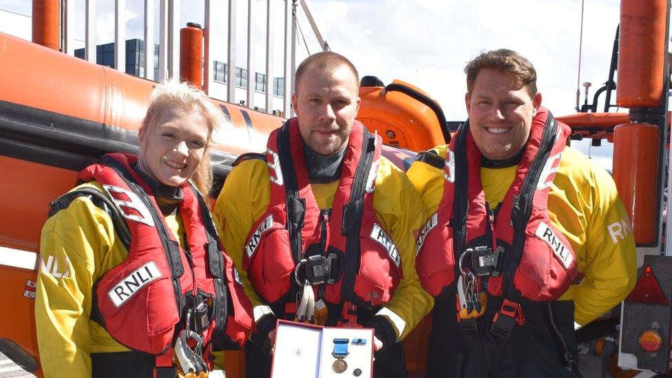 Lifeboat crew (left to right) Emily Craven, Mike Stannard and Oz Ramsay