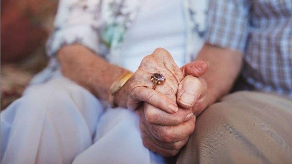 Generic couple holding hands