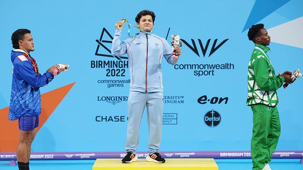 Jeremy Lalrinnunga takes part in the medal ceremony at the Commonwealth Games