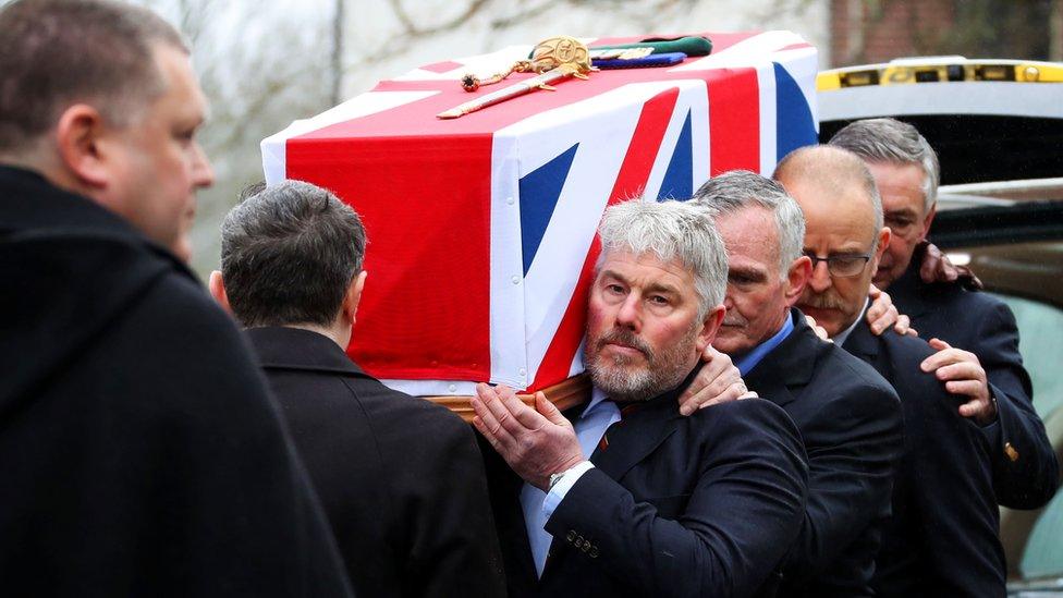 coffin being carried