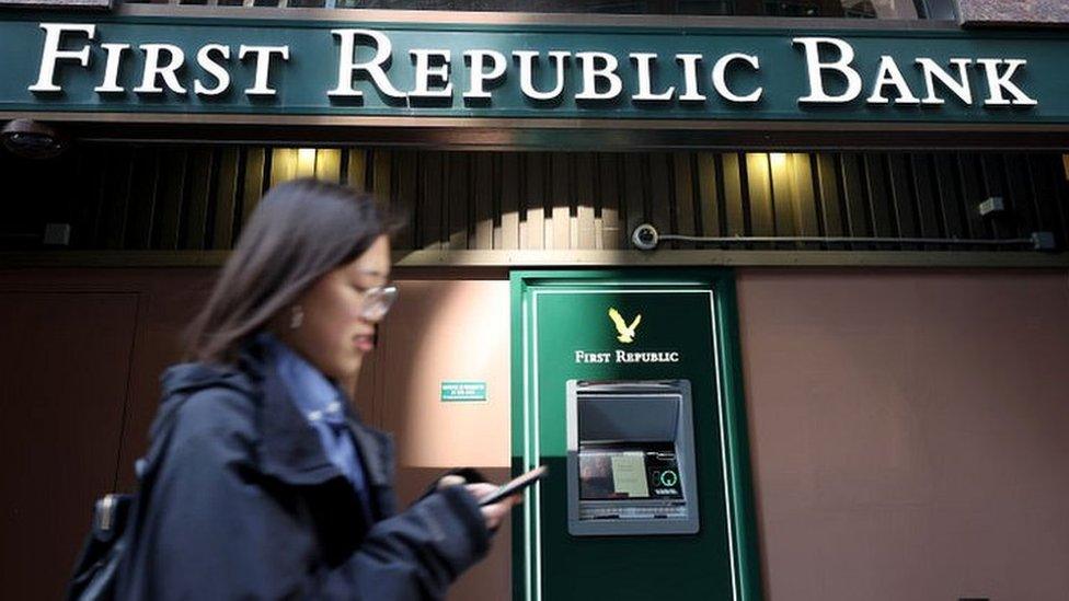 A pedestrian walks by a First Republic Bank office in San Francisco, California.