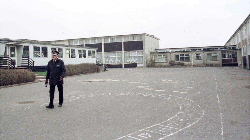 A police officer in the playground of Dunblane Primary School a day after the shooting