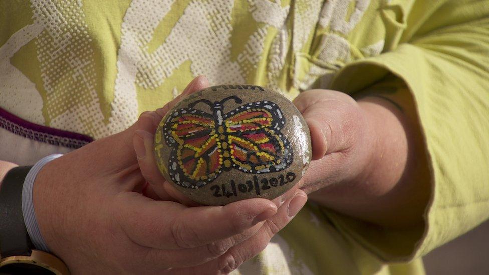 Stone with painted butterfly