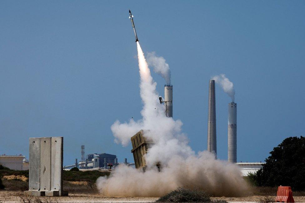 An Israeli Iron Dome missile defence system battery fires an interceptor missile after a rocket is launched from the Gaza Strip by Palestinian militants towards Israel on 7 August 2022