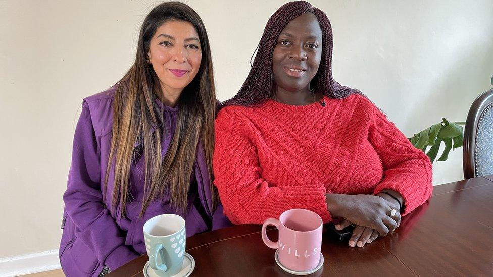 Ms Sheetal (left) wearing a purple with long dark hair and a up of tea smiling and Ms Williams (right) with long dark braided hair and a red jumper smiling