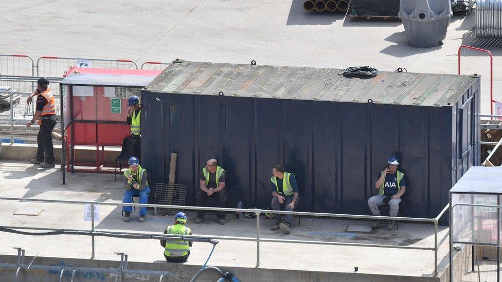 Construction workers socially distance in central London