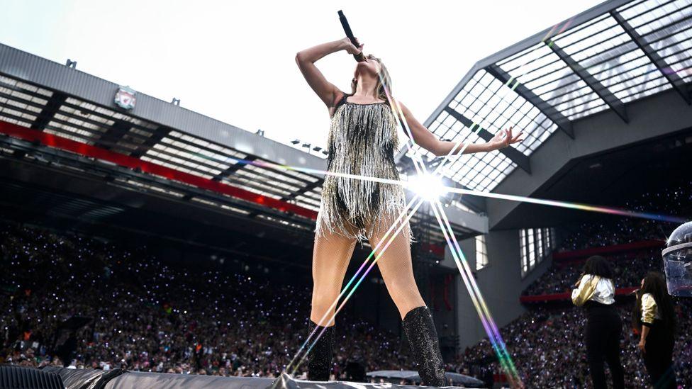 Taylor Swift performing in front a packed Anfield stadium in Liverpool