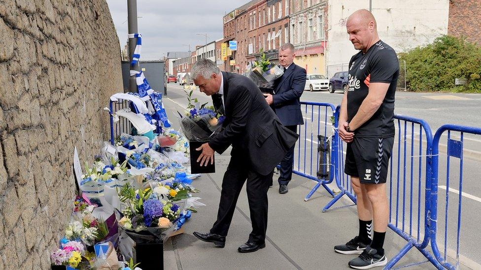 Sean Dyche and Everton ambassadors at site of floral tributes