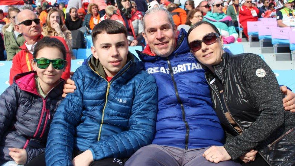 Chris with his family in the stands