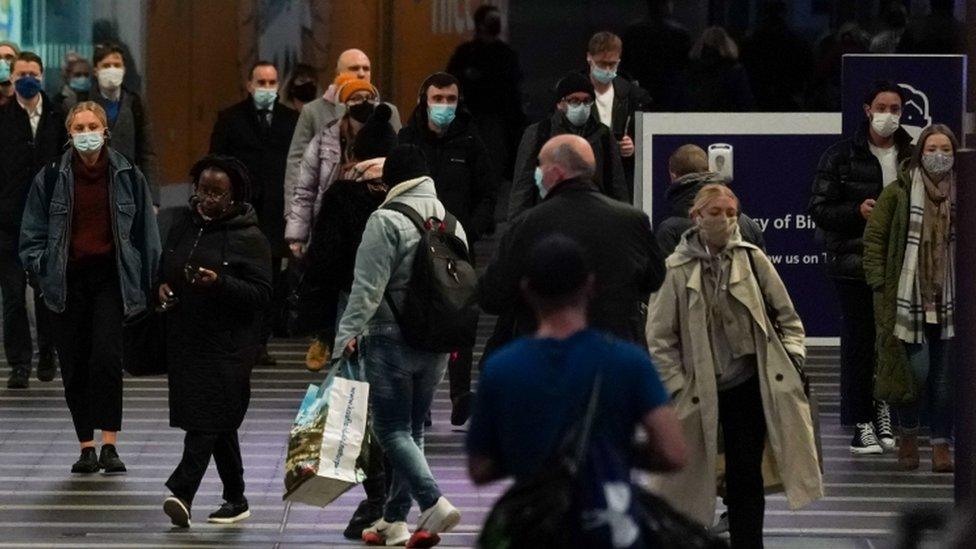 Commuters at Birmingham New Street train station, as mask wearing on public transport becomes mandatory