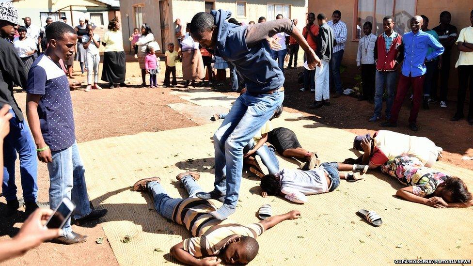 A man jumps on another man