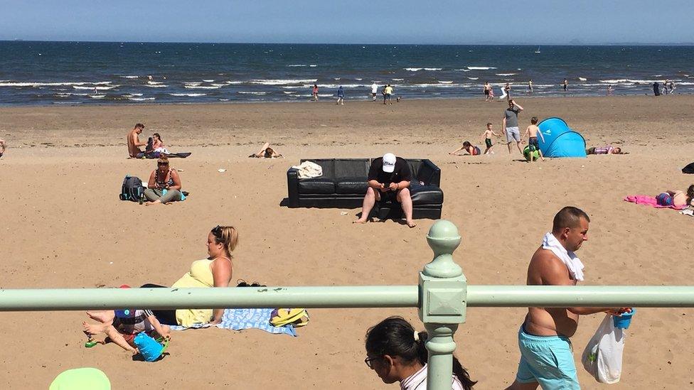 People on Edinburgh's Portobello beach in warm weather