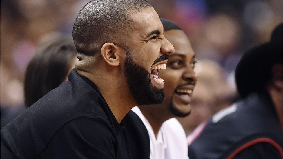 Drake at a basketball game.