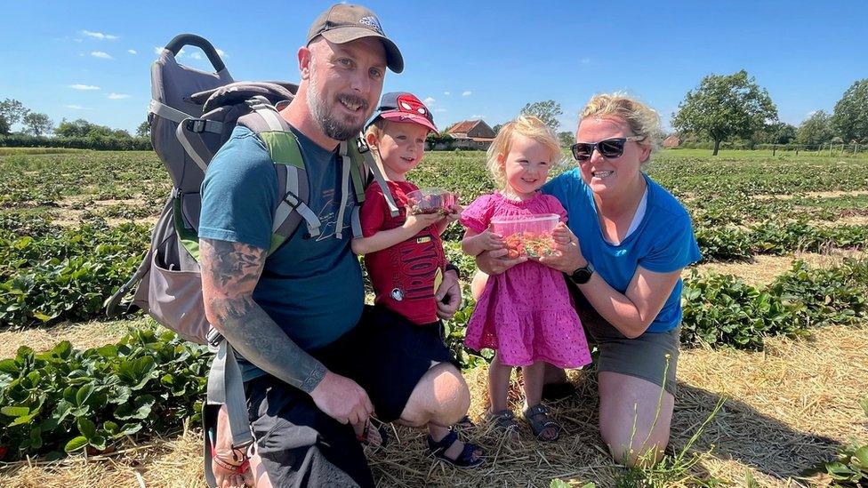 Eddie Dempsey and wife Anna pictured with their children, aged three and two