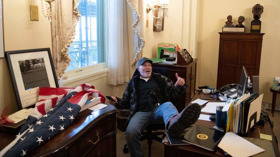 Richard Bigo Barnett with his feet on the desk