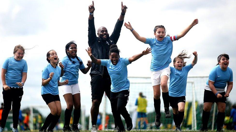 Girls cheering at football