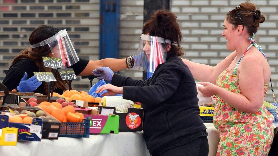 Traders wearing face masks