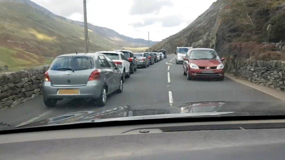 Cars parked along the roadside