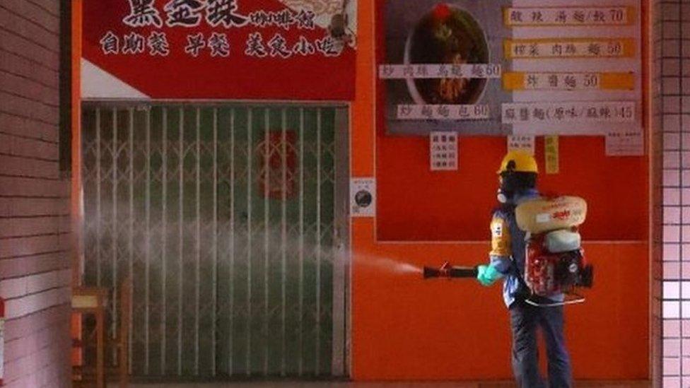 A worker disinfects a school in Taipei, Taiwan. Photo: 16 May 2021