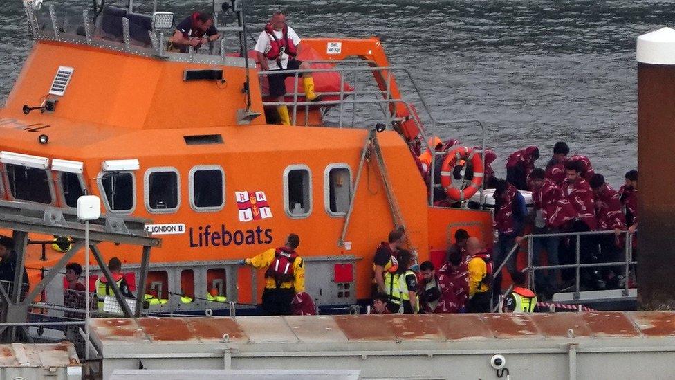 Migrants being brought ashore on 4 September