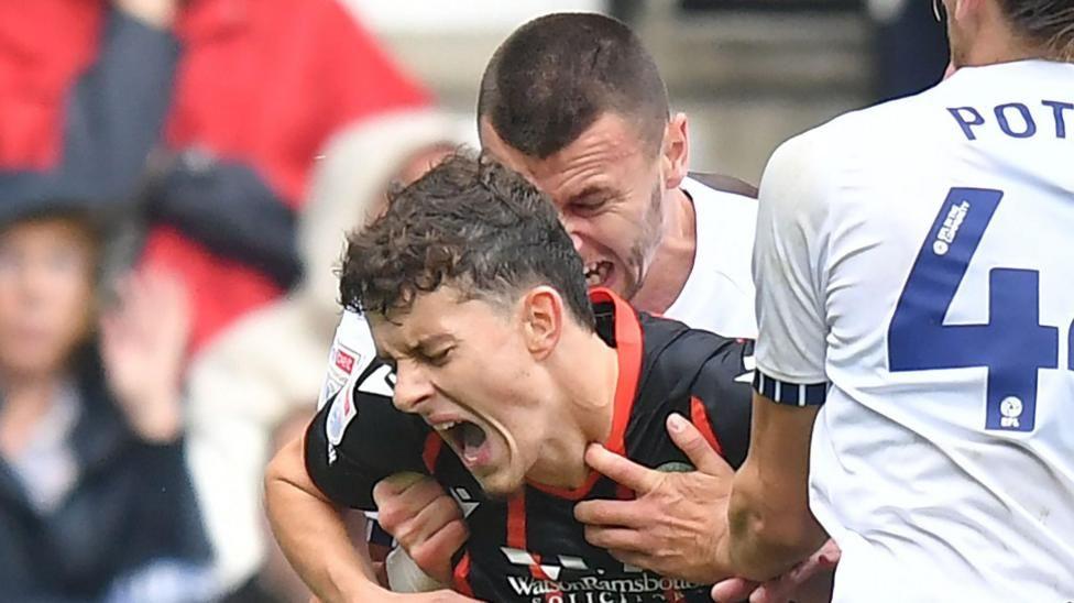 Milutin Osmajic and Owen Beck clash during Sunday's Lancashire derby between Preston North End and Blackburn Rovers