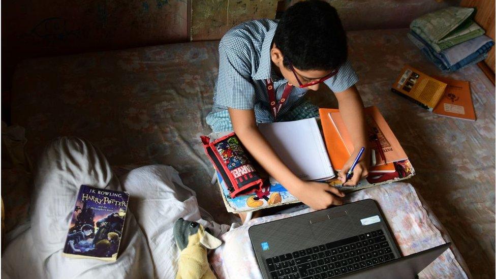 A school student attending an online class from home