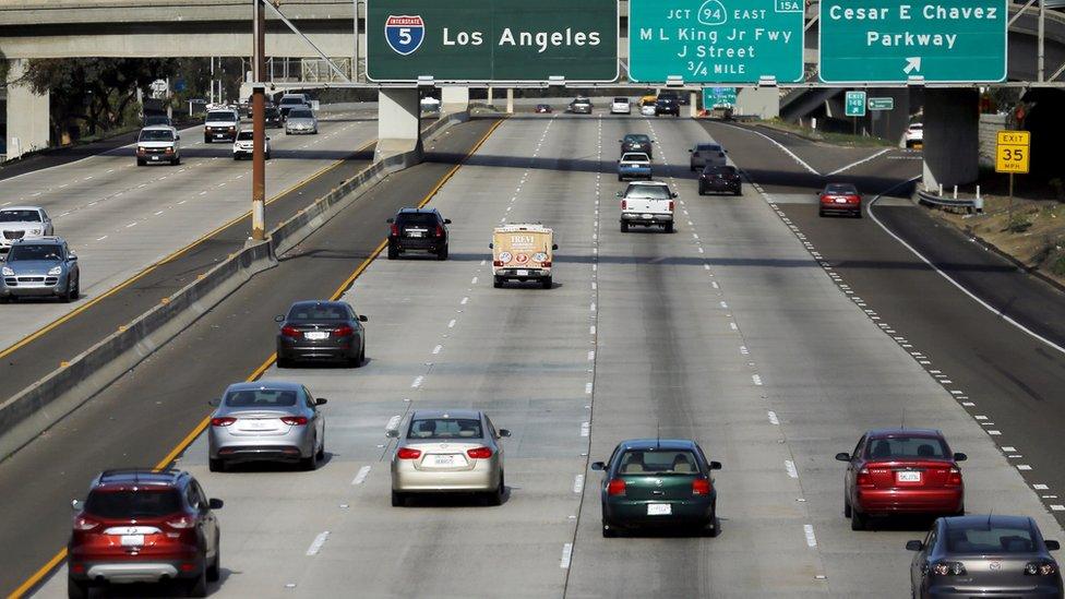 Cars travel north towards Los Angeles on interstate highway 5 in San Diego, California February 10, 2016