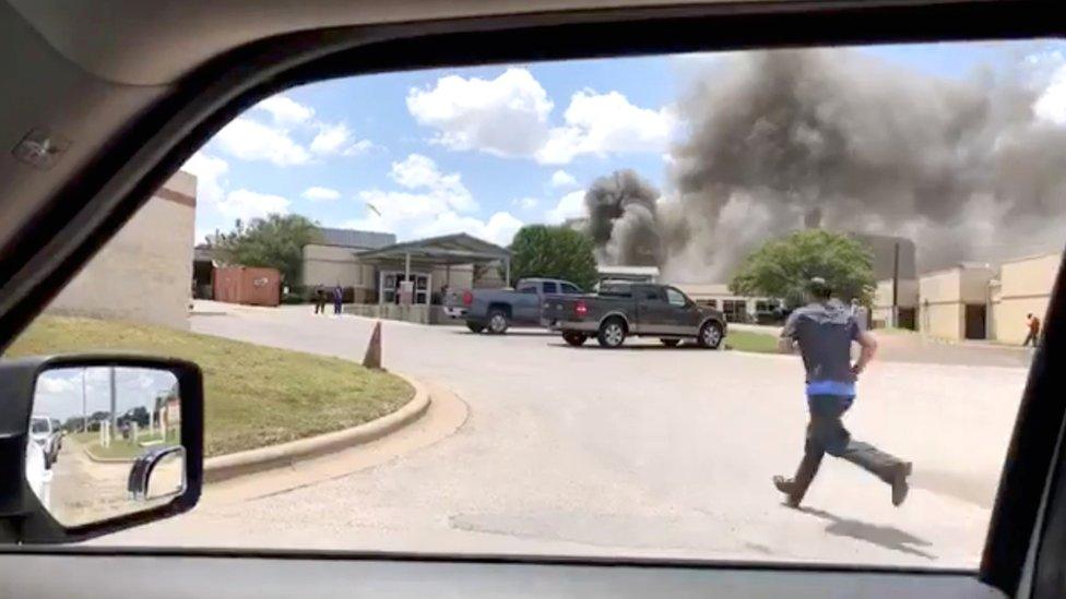 Smoke rises above the Coryell Memorial Hospital in Gatesville, Texas, 26 June 2018