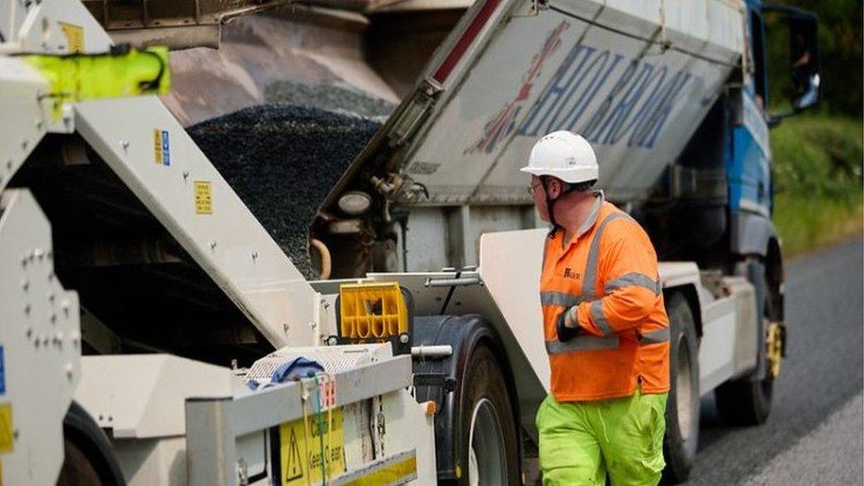 Man working on dressing roads