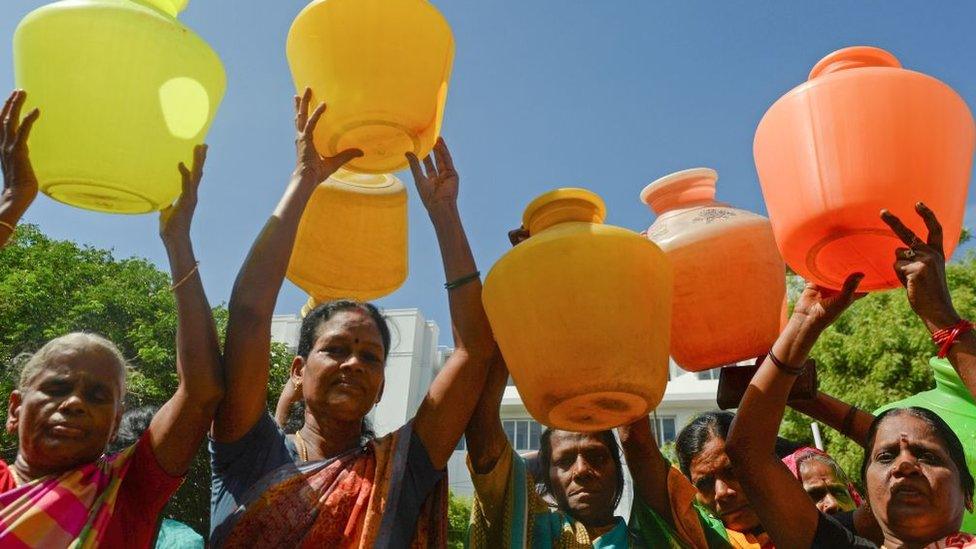 Indian women with empty plastic pots protest as they demand drinking water in Chennai on June 22, 2019.