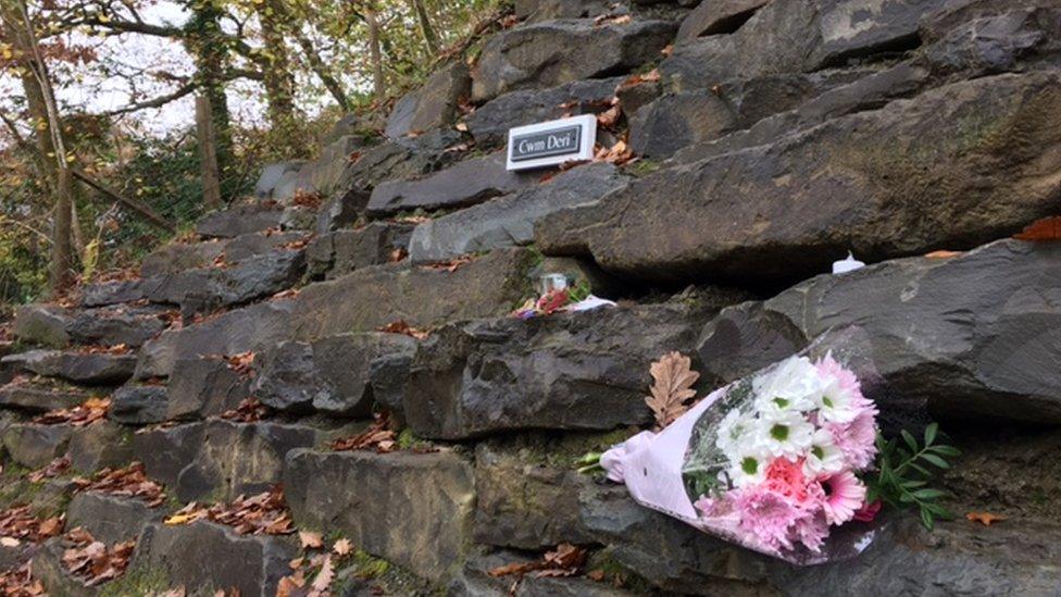 Floral tributes have been left in the village following the fire