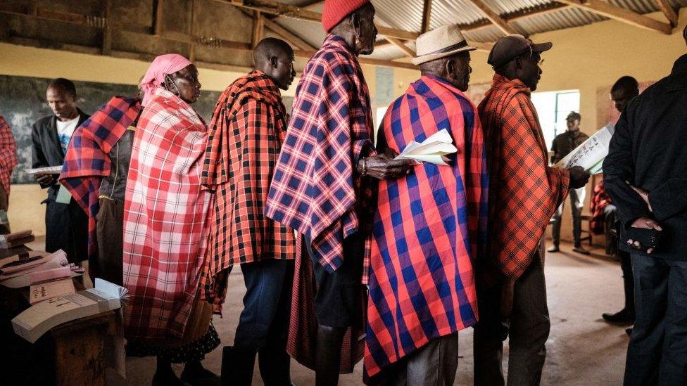 People in a polling station