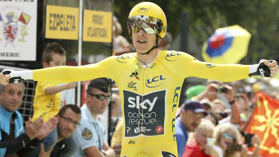 Geraint Thomas celebrates on the finish line of stage 20 of the Tour de France