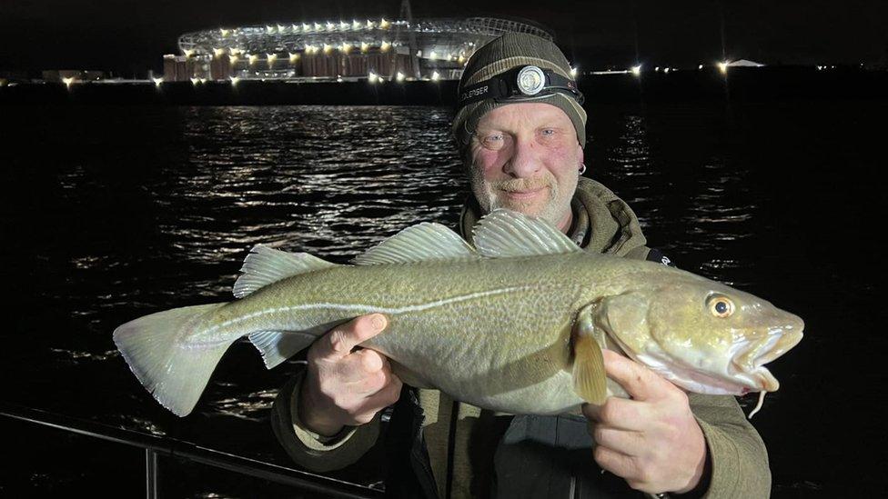 Tony Shep with a cod he caught near the Everton Stadium