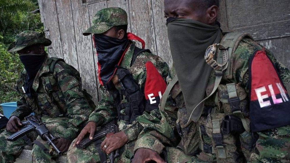 Rebels from Colombia's Marxist National Liberation Army (ELN) take a rest outside a farmer's home, in the northwestern jungles, Colombia on 31 August 2017