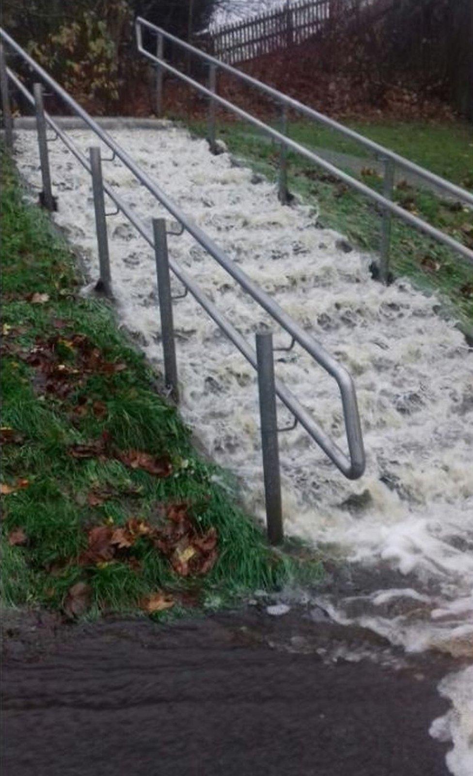 Water gushes down steps in Newcastle