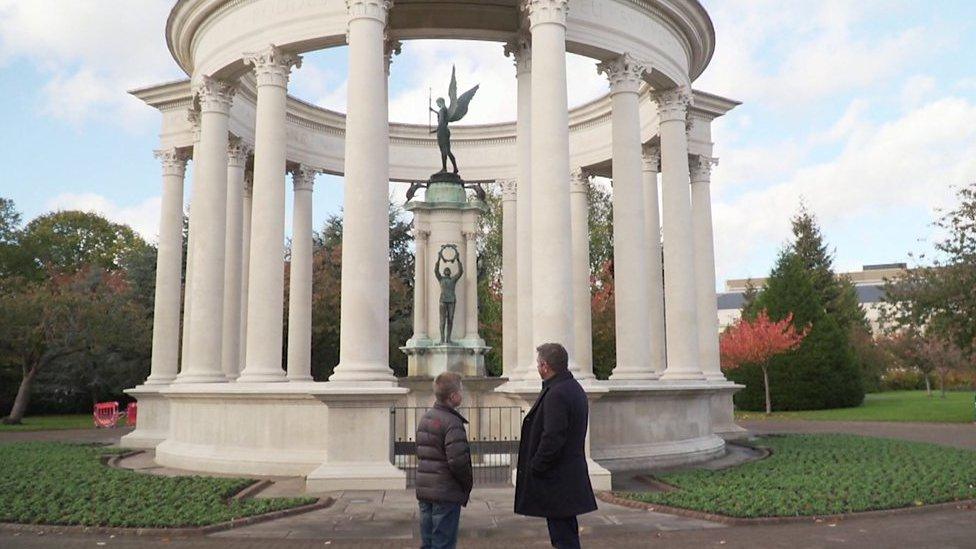 Dafydd and his dad looking at a cenotaph