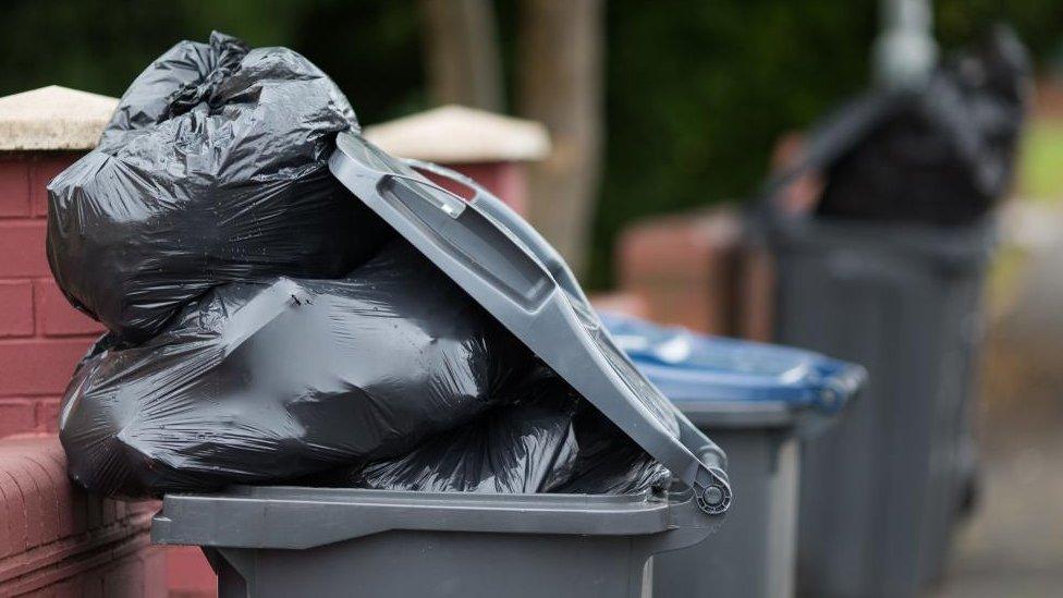 Overflowing waste bin