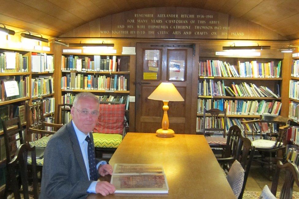 The Very Rev Dr Finlay Macdonald in the library