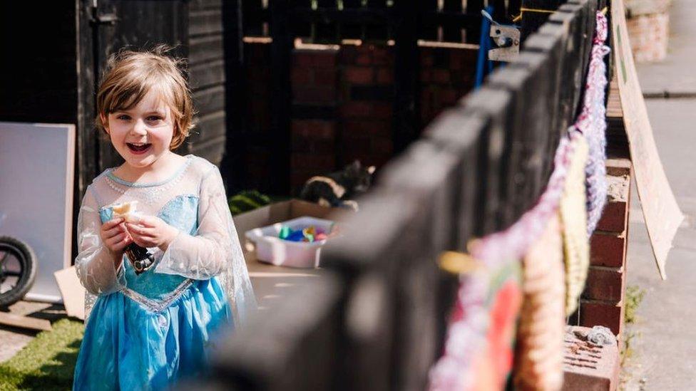 A young girl in a fairy outfit