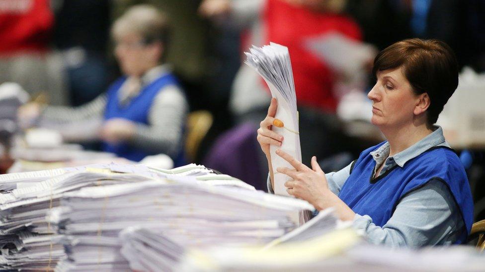 A woman counts votes